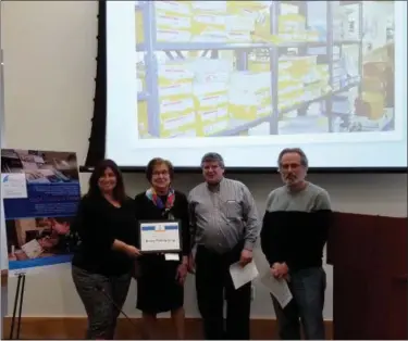  ?? DAN SOKIL - MEDIA NEWS GROUP ?? Keeney Printing Group co-founder Margaret Keeney, center left, and son Michael receive the Lansdale Business of the Month award from Economic Developmen­t Committee Chairwoman Carrie Hawkins Charlton, left, and member Bruce Schwartz, right, during council’s May 15 meeting.