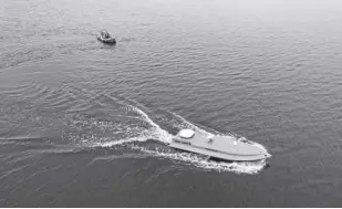  ?? AP/EVGENIY MALOLETKA ?? A SEA drone cruises on the water during a presentati­on by Ukraine’s Security Service in Kyiv region, Ukraine on March 5, 2024.