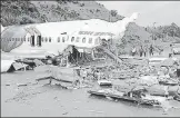  ?? ANI ?? ■
Officials inspect the wreckage of the Air India Express flight at the Kozhikode Internatio­nal Airport on August 8.