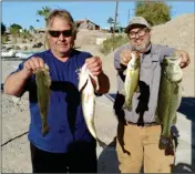  ??  ?? Fishing Club’s January tournament winners are Curt Cernik and Bob LaLonde with their 10.43 lb. bag as well as taking second place big fish honors with a bass weighing 4.31.