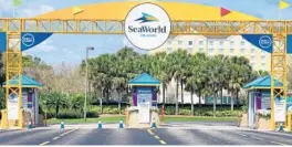  ?? JOE BURBANK/ORLANDO SENTINEL ?? Parking turnstiles are empty at SeaWorld Orlando in March.