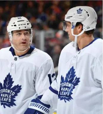  ?? ANDY DEVLIN/NHLI VIA GETTY IMAGES ?? Patrick Marleau, left, offered some inspiratio­n in the second intermissi­on Saturday in Ottawa while Ron Hainsey, right, provided some on-ice guidance. It’s the type of leadership Leafs coach Mike Babcock wants.