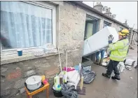  ??  ?? COUNTING COST: The clean up continues after the flooding in Inverurie.