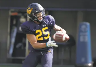  ?? Paul Chinn / The Chronicle ?? Cal’s Nikko Remigio had 111 catches for 1,695 receiving yards and 19 touchdowns for Mater Dei-Santa Ana (Orange County), which he led to MaxPreps’ No. 1 national ranking last year.