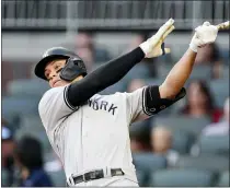  ?? JOHN BAZEMORE — THE ASSOCIATED PRESS ?? New York Yankees right fielder Aaron Judge (99) bats during a baseball game against the Atlanta Braves- Tuesday, Aug. 24, 2021, in Atlanta.
