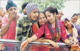  ?? PTI ?? Family members weep as body of slain BSF soldier Gurnam Singh arrives at his village on Sunday.