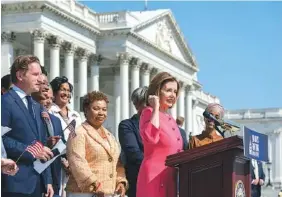  ?? AP PHOTO/J. SCOTT APPLEWHITE ?? Speaker of the House Nancy Pelosi, D-Calif., and the Democratic Caucus hold an event on the House steps on Thursday. The House leaves for a five week August recess Friday.