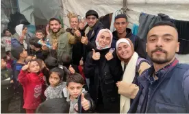  ?? Photograph: Mai al-Afifi ?? Mai al-Afifi, 23, who works with the Sharek Youth Forum, with other volunteers and children in Rafah.