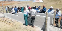  ?? Picture: SUPPLIED ?? GETTING STUCK IN: Mnquma mayor Sithembiso Ncetezo, third from right, at the official celebratio­n held by Ntwala villagers on Friday October 26 FOR the building of their own hall and dipping tank.