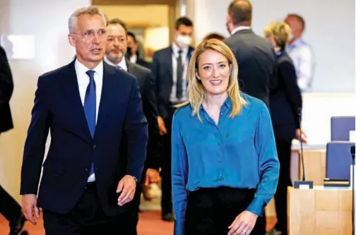  ?? Agence France-presse ?? European Parliament President Roberta Metsola (right) and NATO Secretary General Jens Stoltenber­g arrive for a meeting of the European Parliament’s Conference of Presidents at the European Parliament in Brussels on April 28, 2022.