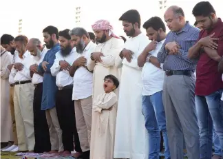  ?? Photo by Shihab ?? Eid Al Fitr prayers at Al Shaab village, Sharjah. —