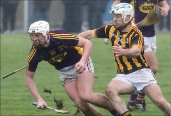  ??  ?? Aaron Maddock of Wexford breaks away from Kilkenny attacker Jonjo Farrell.