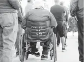  ??  ?? Veterans line up Saturday at the clinic, whose staffers planned to provide 700 vaccinatio­ns.