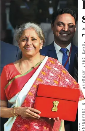  ??  ?? Finance Minister Nirmala Sitharaman holds a folder containing the Union Budget proposals at North Block in New Delhi on Monday
