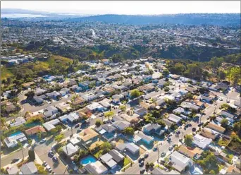  ?? K.C. ALFRED U-T FILE ?? Prices of all home types, such as these single-family homes in Clairemont, appeared to hold steady or exceed previous highs. The county’s median of a resale single-family home was $820,500 in November.