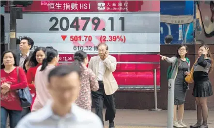  ?? Jerome Favre
European Pressphoto Agency ?? CHINA’S stock markets — and others worldwide — may be in for more white-knuckle days. Above, the Hang Seng index in Hong Kong.