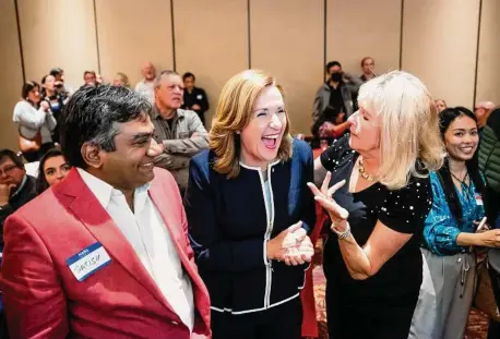  ?? Noah Berger/Special to The Chronicle ?? Santa Clara Mayor Lisa Gillmor (center) won re-election despite being outspent by an 8-to-1 margin during the campaign.