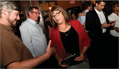  ?? (Reuters) ?? VERMONT DEMOCRATIC Party gubernator­ial primary candidate Christine Hallquist, a transgende­r woman, attends her election night party in Burlington last week.