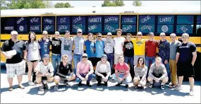  ?? SHELLEY WILLIAMS SPECIAL TO THE ENTERPRISE-LEADER ?? The 2018 Prairie Grove baseball team coached by Chris Mileham (left) poses outside the high school before leaving for the State 4A baseball tournament in May. Four Tigers were selected to the 4A-1 All-Conference baseball team.