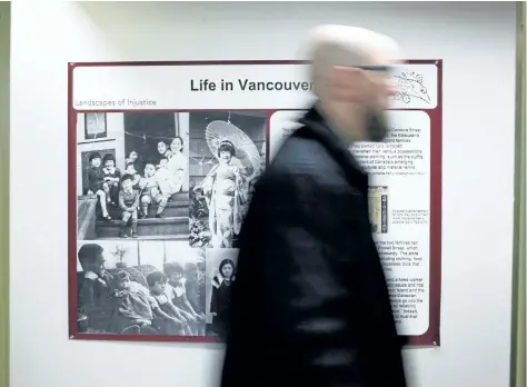  ?? CHAD HIPOLITO/THE CANADIAN PRESS ?? UVic historian Jordan Stanger-Ross is leading Landscapes of Injustice, a research project in the field of humanities in Canada about the letters of outrage reflecting injustices towards Japanese Canadians as he walks by Landscape of Injustice sign in...