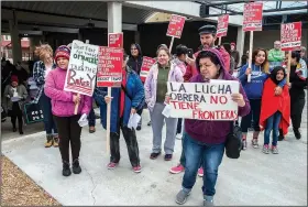  ?? NWA Democrat-Gazette/ANTHONY REYES • @NWATONYR ?? Protesters gather Monday before a march in Springdale during a May Day rally hosted by the Northwest Arkansas Workers’ Justice Center and Ozark Indivisibl­e. The group heard speakers and march in defense of workers rights and the rights of immigrants.