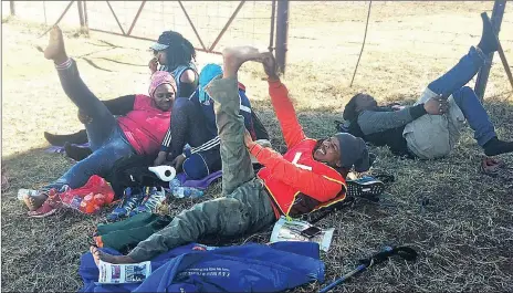  ??  ?? EXERCISE: The 39-year-old had to do stretches during his long walk from Cape Town to Mahikeng.