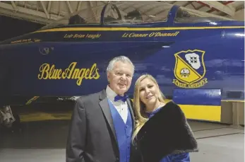  ?? ROMAN FLORES PHOTO ?? FROM LEFT: Les and Terri Rogers pose for a photo near a Boeing F/A-18 Super Hornet at the 17th Annual “Wings of Elegance” Air Show Gala on Friday, February 9, at Naval Air Facility El Centro.