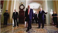  ??  ?? WASHINGTON: In this Nov 10, 2016 file photo, President-elect Donald Trump (center) walks with Senate Majority Leader Mitch McConnell of Ky after a meeting on Capitol Hill in Washington. — AP