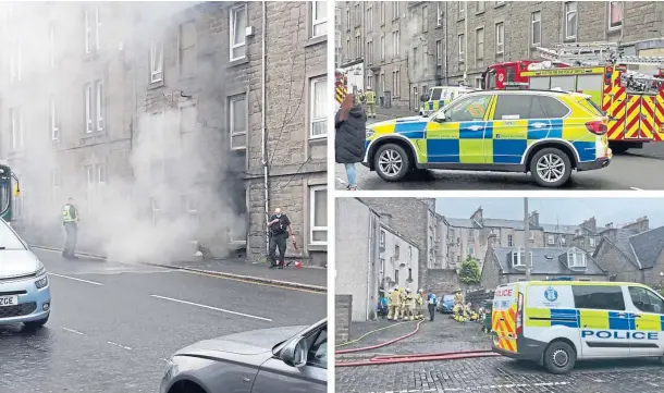  ??  ?? BLAZE: Members of the public using fire extinguish­ers tried to put out the flames before police and fire crews arrived at the scene in Albert Street.