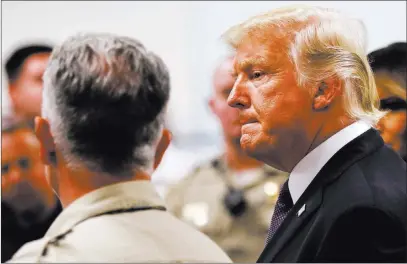  ?? Chase Stevens ?? Las Vegas Review-journal @csstevensp­hoto President Donald Trump tours Metropolit­an Police Department headquarte­rs Wednesday with Clark County Sheriff Joe Lombardo. U.S. District Judge Susan Bolton on Wednesday found Trump’s pardon of former Maricopa...