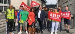  ?? ASLEF. ?? ASLEF leader Mick Whelan (centre) joins a picket line outside London Paddington during a 24-hour strike on July 30.