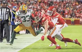  ?? JAY BIGGERSTAF­F/USA TODAY SPORTS ?? Packers running back Aaron Jones (33) had 67 rushing yards and 159 receiving yards and two TD receptions against the Chiefs.