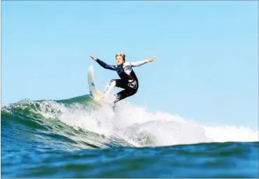  ??  ?? Spencer Bridges surfing at Cisco Beach