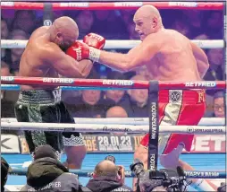  ?? ?? Tyson Fury pummels Derek Chisora last night