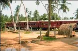  ??  ?? David Jones with the pictures he took in Sri Lanka Inset: This train was submerged in the tsunami, killing thousands on board