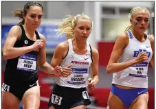  ?? (Photo courtesy UA Athletics) ?? Lauren Gregory (center) finished second for Arkansas in the women’s 3,000-meter run Saturday in the NCAA Indoor Track and Field Championsh­ips in Fayettevil­le. The Razorbacks went on to win the national championsh­ip with 68 points.