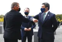  ?? ( Michele Tantussi/ Reuters) ?? UAE FOREIGN MINISTER Sheikh Abdullah bin Zayed al- Nahyan and his Israeli counterpar­t, Gabi Ashkenazi, greet each other during a visit on Tuesday to Berlin’s Holocaust Memorial together with their host, German Foreign Minister Heiko Maas.