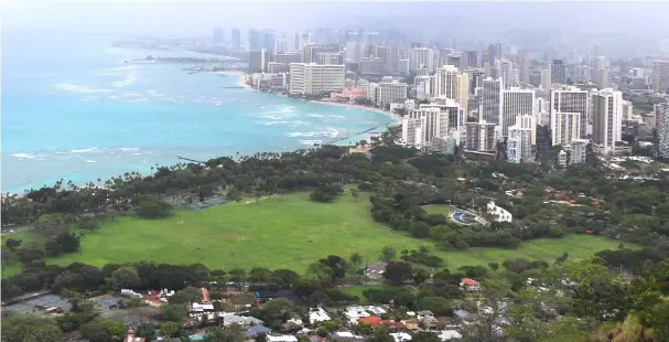  ??  ?? The towers of Waikiki Beach are seen from the top of Diamond Head State Monument.