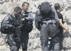  ??  ?? Israeli police detain a Palestinia­n youth in Jerusalem’s Old City