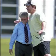  ?? MARK HUMPHREY — THE ASSOCIATED PRESS FILE ?? In this file photo, Tennessee Titans interim president Steve Underwood, left, gets a hug from former Titans tight end Frank Wycheck during NFL football minicamp Nashville, Tenn. Wycheck says he’s glad the Bills have finally returned to the playoffs,...