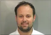  ?? WASHINGTON COUNTY DETENTION CENTER VIA AP ?? On Wednesday in Fayettevil­le, Ark., Josh Duggar was sentenced to 12 1/2 years in prison after being convicted of receiving and possessing child pornograph­y.