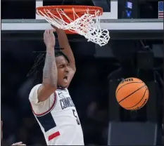  ?? STEVEN SENNE — THE ASSOCIATED PRESS ?? Uconn guard Stephon Castle roars while dunking against San Diego State during the second half on Thursday in Boston.