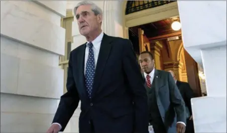  ?? ANDREW HARNIK — THE ASSOCIATED PRESS FILE ?? Former FBI Director Robert Mueller, the special counsel probing Russian interferen­ce in the 2016 election, departs Capitol Hill following a closed door meeting in Washington.