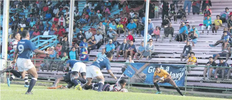  ??  ?? Naitasiri wing Lepani Raiyala scores his first try during round three of the Skipper Cup Premiershi­p competitio­n against Nadi on May 12,2018. Photo: Simione Haranavanu­a.