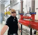  ?? ELIZABETH WEISE/USA TODAY ?? Building engineer Michael Hurtado leads a maintenanc­e team that ensures the safety of the Ahern Hotel off the Las Vegas Strip. A filter on the incoming city water supply line removes solids and sediment that are characteri­stic of Las Vegas’ hard water.