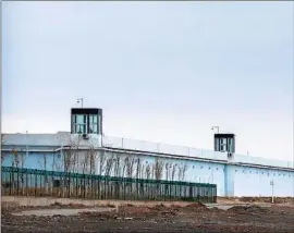  ?? Mark Schiefelbe­in Associated Press ?? MORE INVESTOR and consumer scrutiny is expected over links between Ganfeng Lithium Co. and China’s Xinjiang region. Above, a Xinjiang detention center.