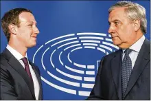 ?? GEERT VANDEN WIJNGAERT / ASSOCIATED PRESS ?? European Parliament President Antonio Tajani (right) welcomes Facebook CEO Mark Zuckerberg upon his arrival at the EU Parliament in Brussels, Tuesday.