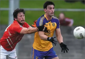  ??  ?? Hunterstow­n’s Padraig Matthews tries to intercept a pass for Darren McMahon of St Mochta’s.