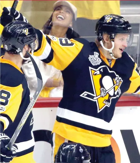  ?? | GENE J. PUSKAR/ AP ?? The Penguins’ Jake Guentzel celebrates a goal during the third period of Game 2 onWednesda­y in Pittsburgh.