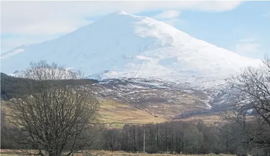  ?? Picture: Angus Whitson. ?? Framed by a bright blue sky, the snow-covered summit of Schiehalli­on sparkles in strong winter sunshine.